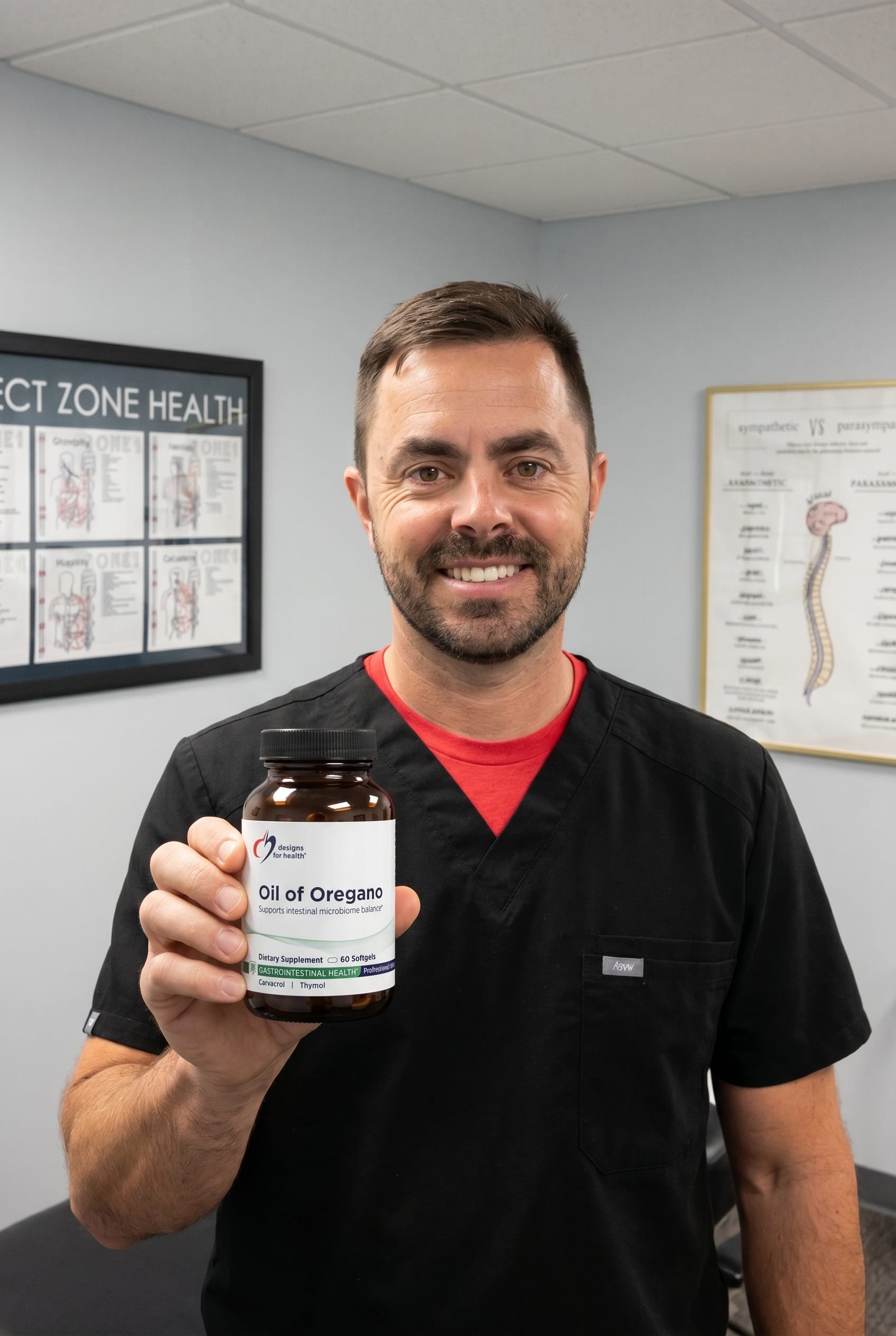 Dr. Bell holding Oil of Oregano