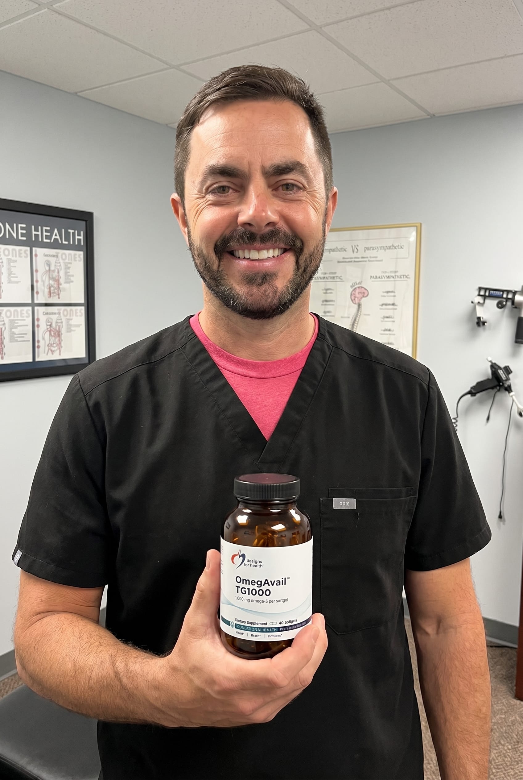 Dr. Bell holding OmegAvail TG1000