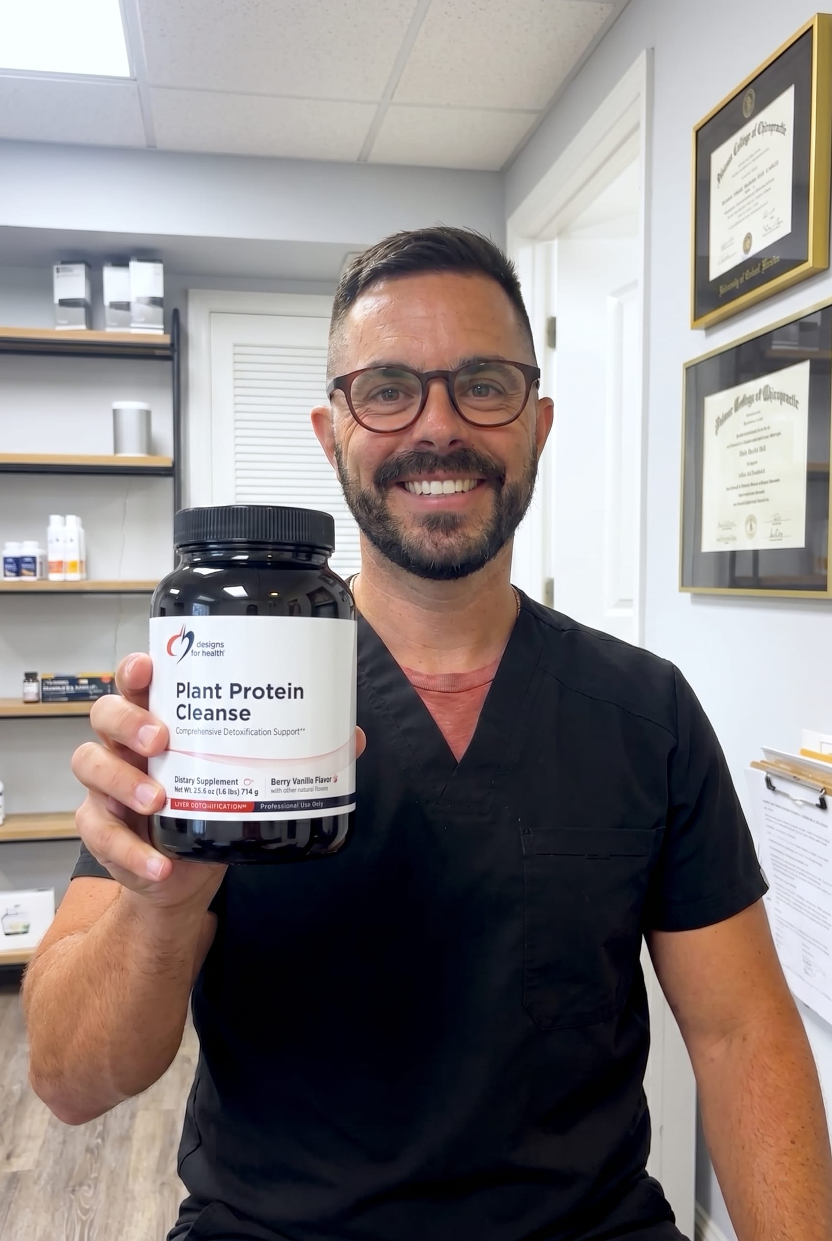 Dr. Bell holding Plant Protein Cleanse
