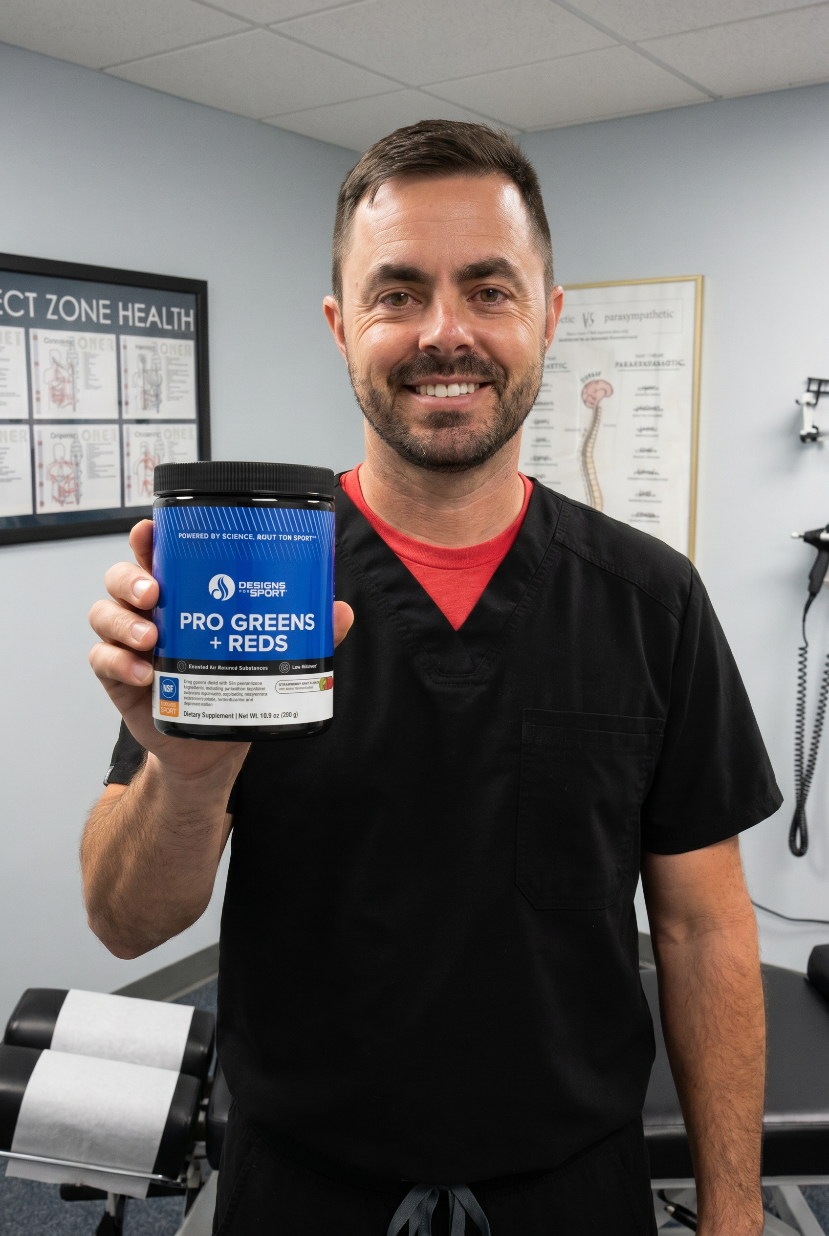 Dr. Bell holding Pro Greens + Reds