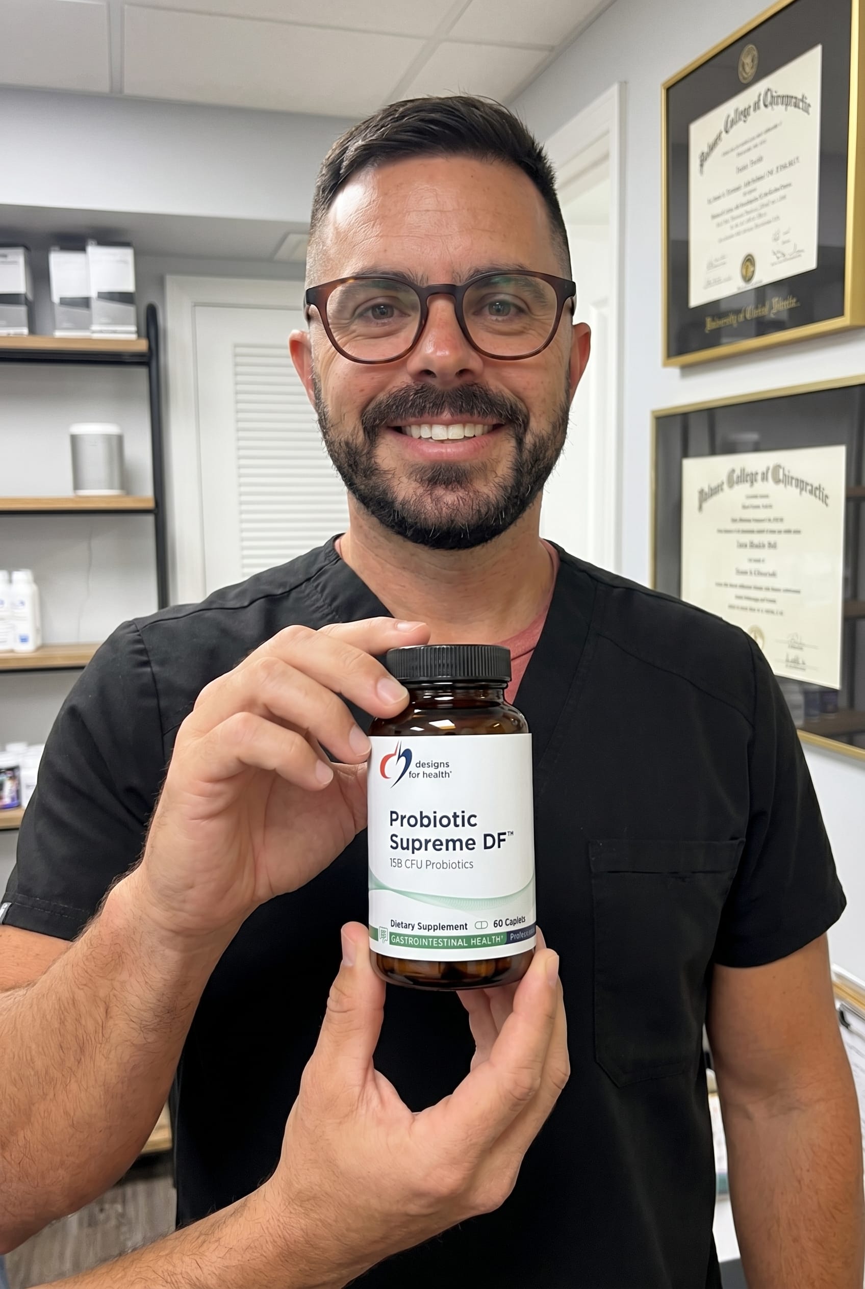 Dr. Bell holding Probiotic Supreme DF