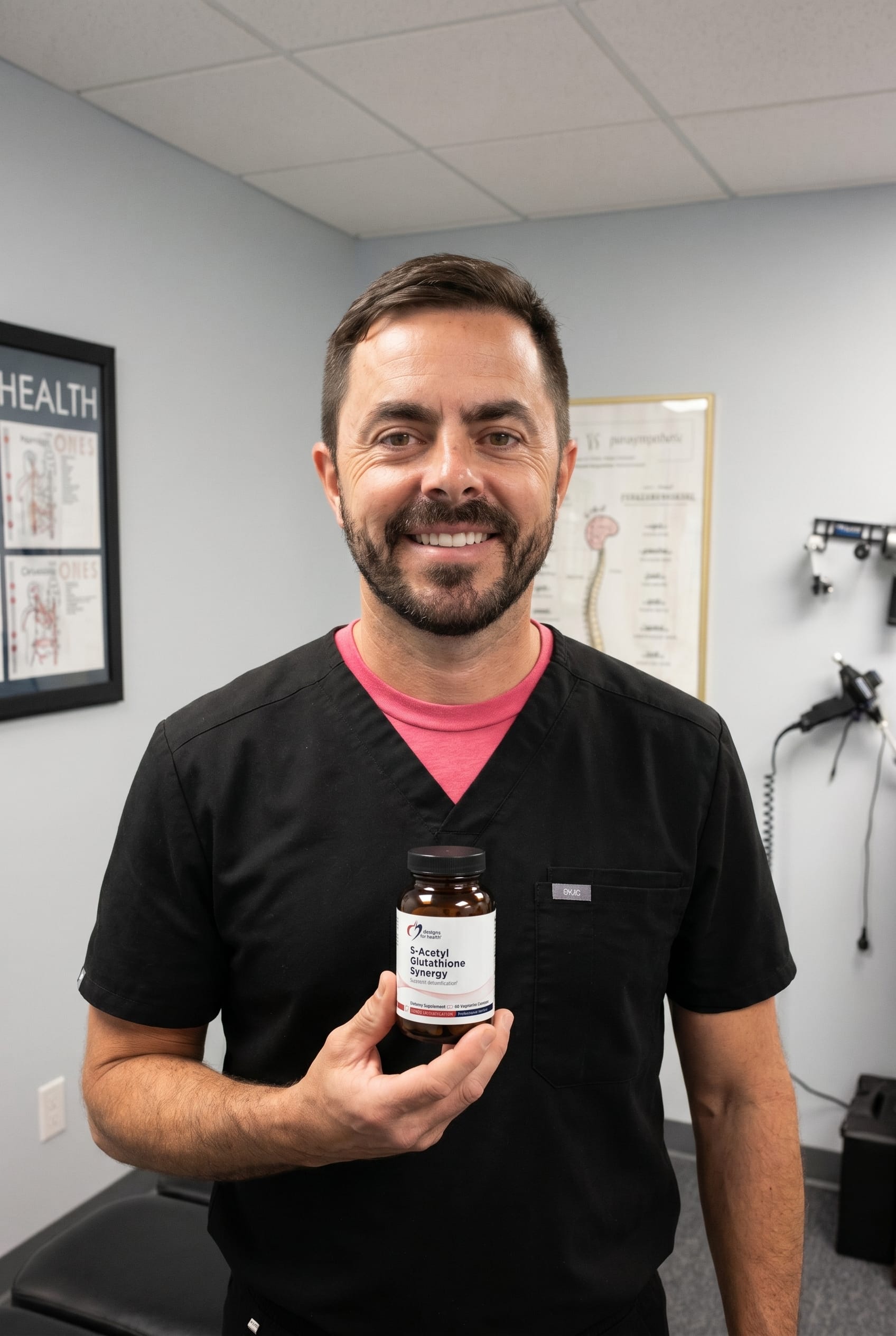 Dr. Bell holding S-Acetyl Glutathione Synergy