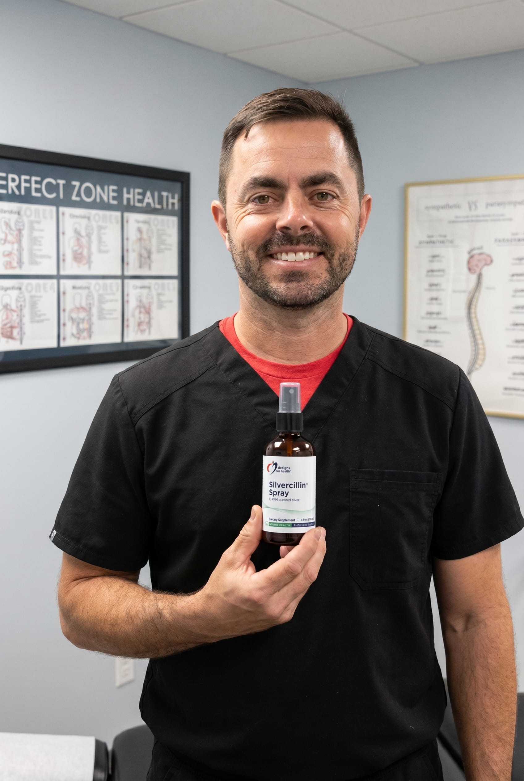 Dr. Bell holding Silvercillin Spray