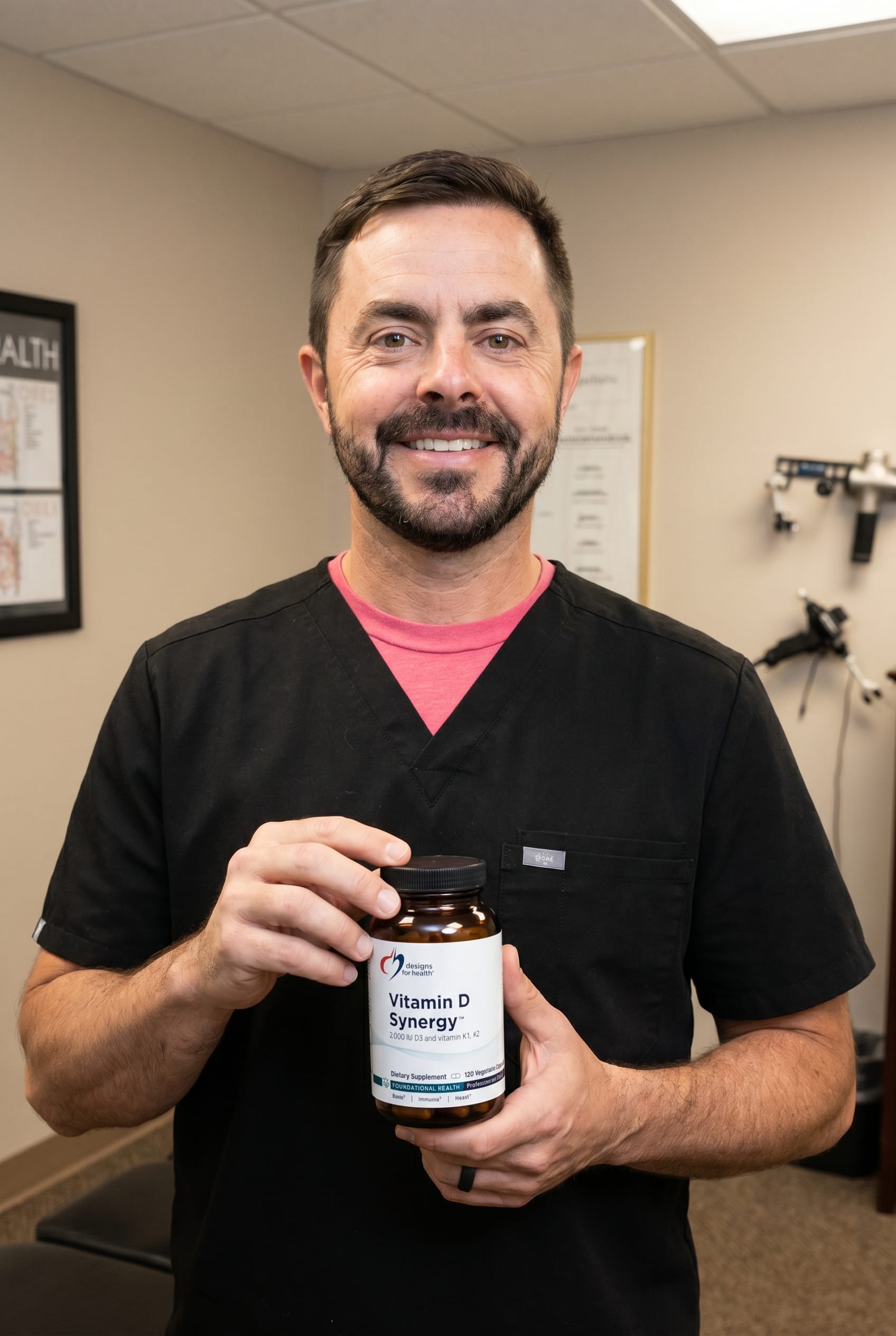 Dr. Bell holding Vitamin D Synergy