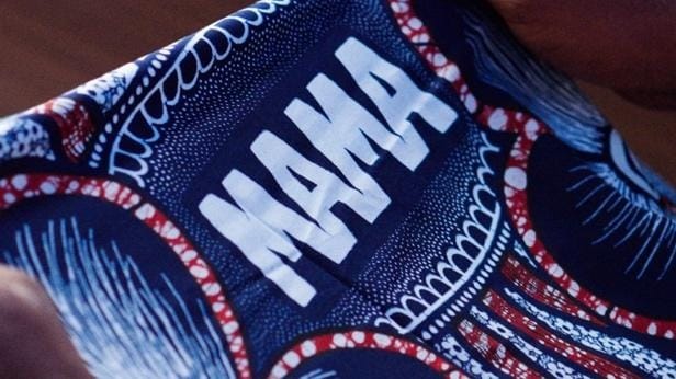 A close-up of a blue fabric with white text
AI-generated content may be incorrect.