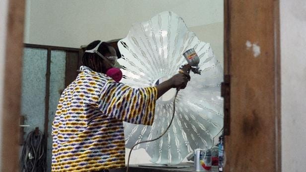 A person painting a glass sculpture
AI-generated content may be incorrect.
