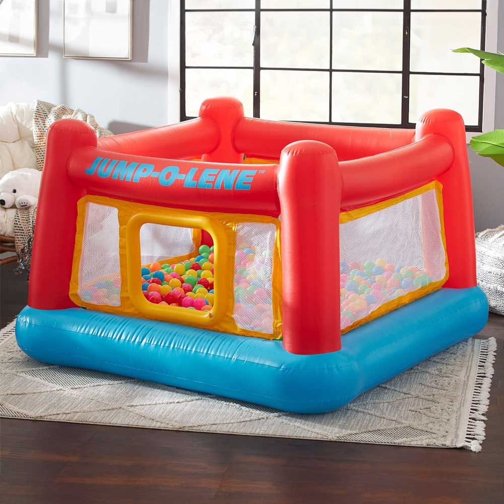 Colorful inflatable bouncy castle for toddlers with mesh walls and crawl-through door — safe, active outdoor playhouse for kids aged 3 to 6