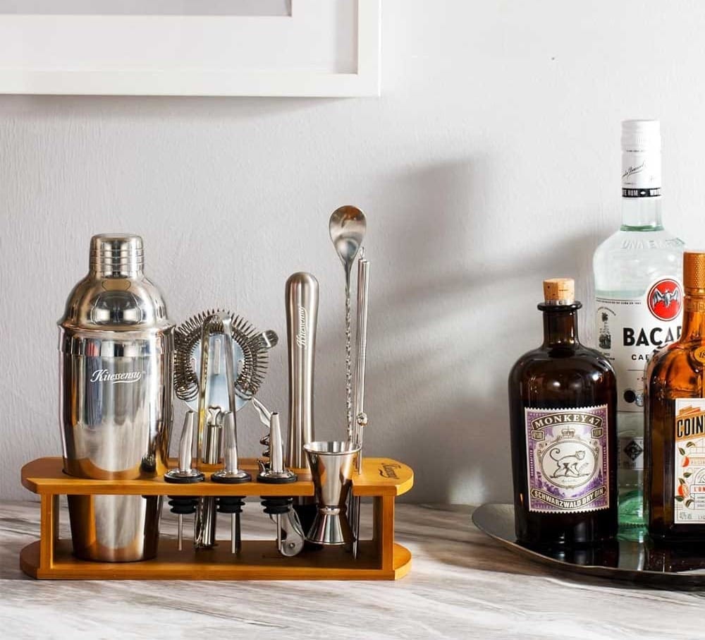 15-piece stainless steel cocktail shaker and bartender set with wooden stand and recipe guide — ideal housewarming gift for home entertaining