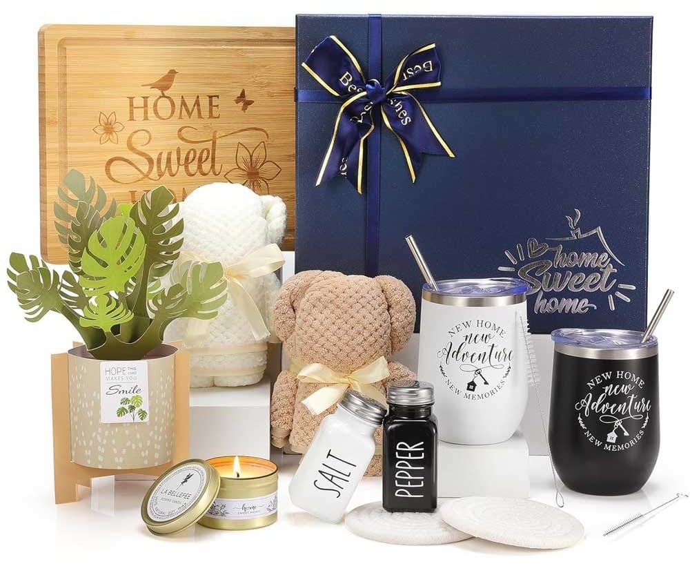 Luxury housewarming gift basket with bamboo board, towels, salt & pepper shakers, thermos cups, candle, and elegant packaging — perfect new home present