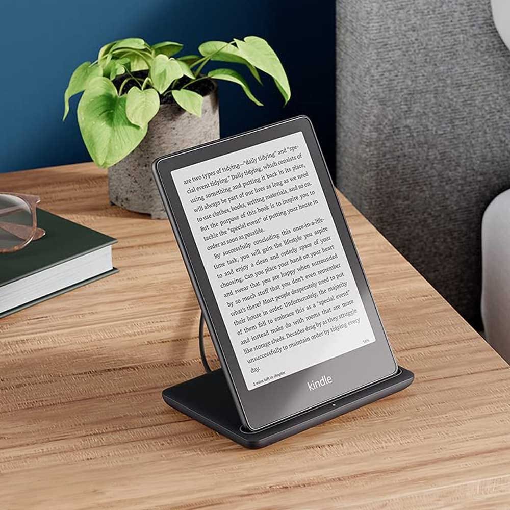 Kindle Paperwhite Signature Edition resting on a cozy armchair — a modern, lightweight e-reader that makes reading easier and more enjoyable for Grandpa