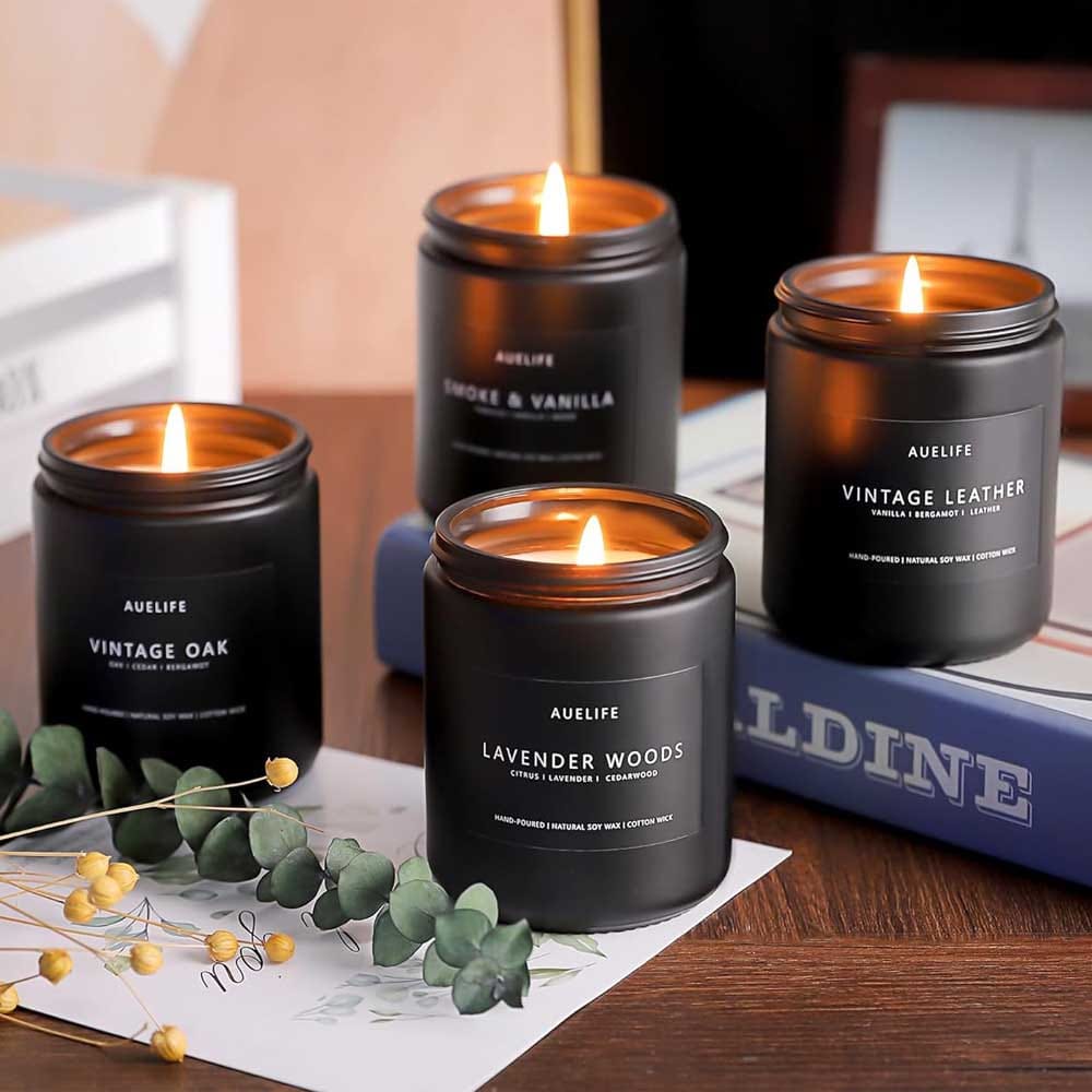 Set of masculine scented candles in black jars with woodsy, smoky, and leather-inspired fragrances for a relaxing and stylish vibe