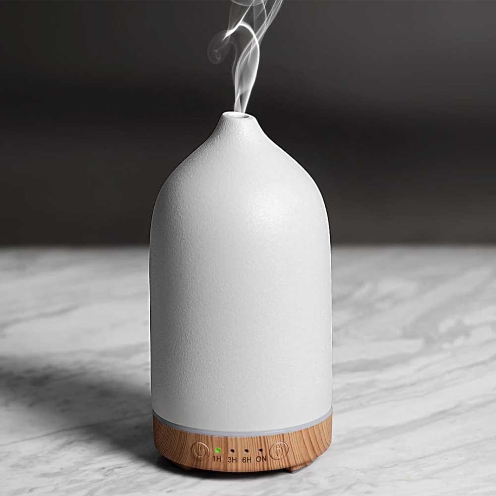 Elegant ceramic essential oil diffuser with color-changing lights — calming home gift for couples who value wellness and ambiance