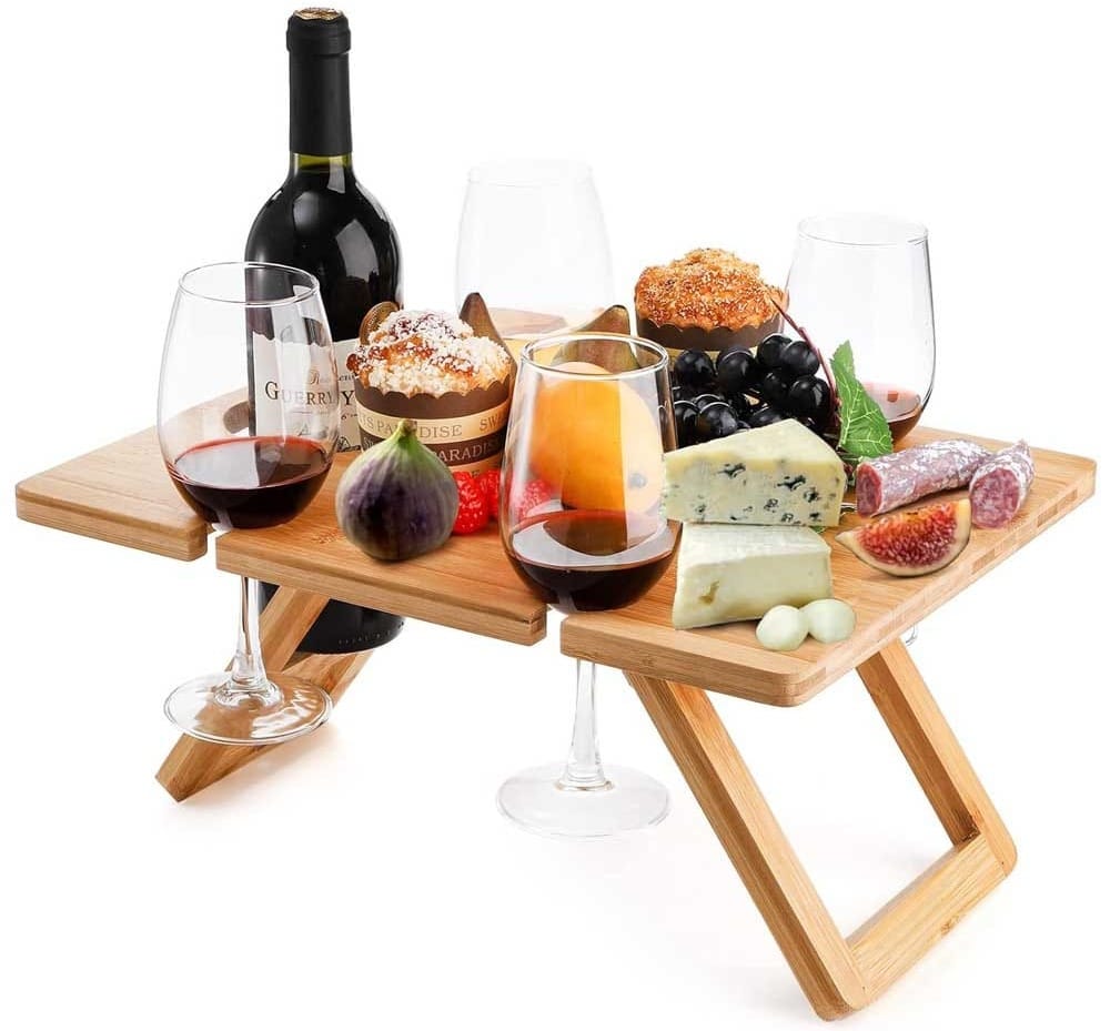Foldable portable picnic table with wine glass holders and bottle slot — compact outdoor table for wine lovers and picnics
