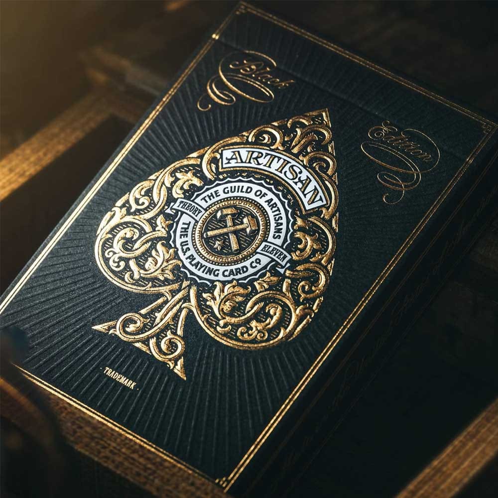 Luxury black and gold playing cards with foil detailing and vintage tax seal — a premium gift for boyfriends who enjoy poker nights or collectible design