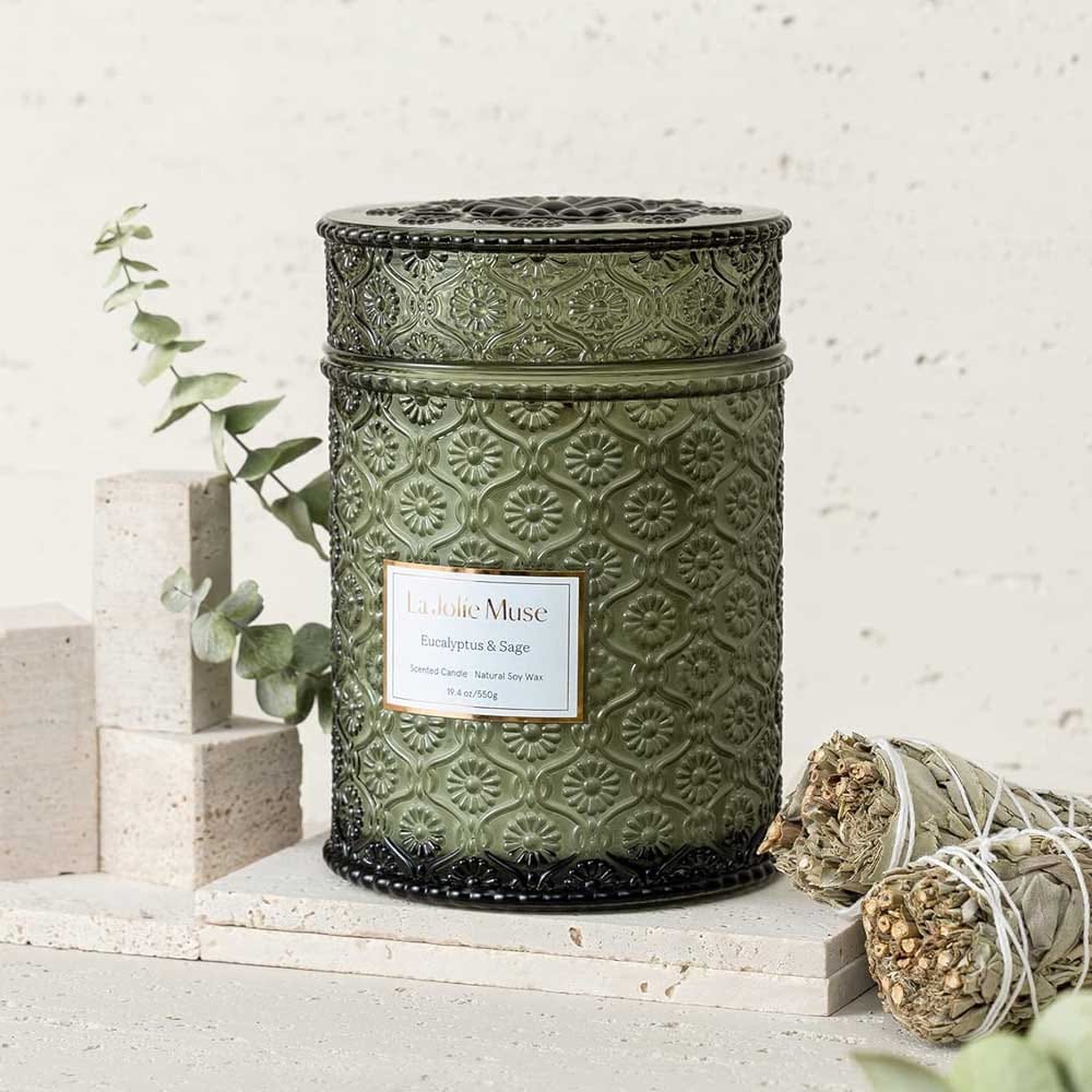 Large eucalyptus-scented candle in embossed glass jar with wood wick — romantic gift for engaged couples who love calming moments at home
