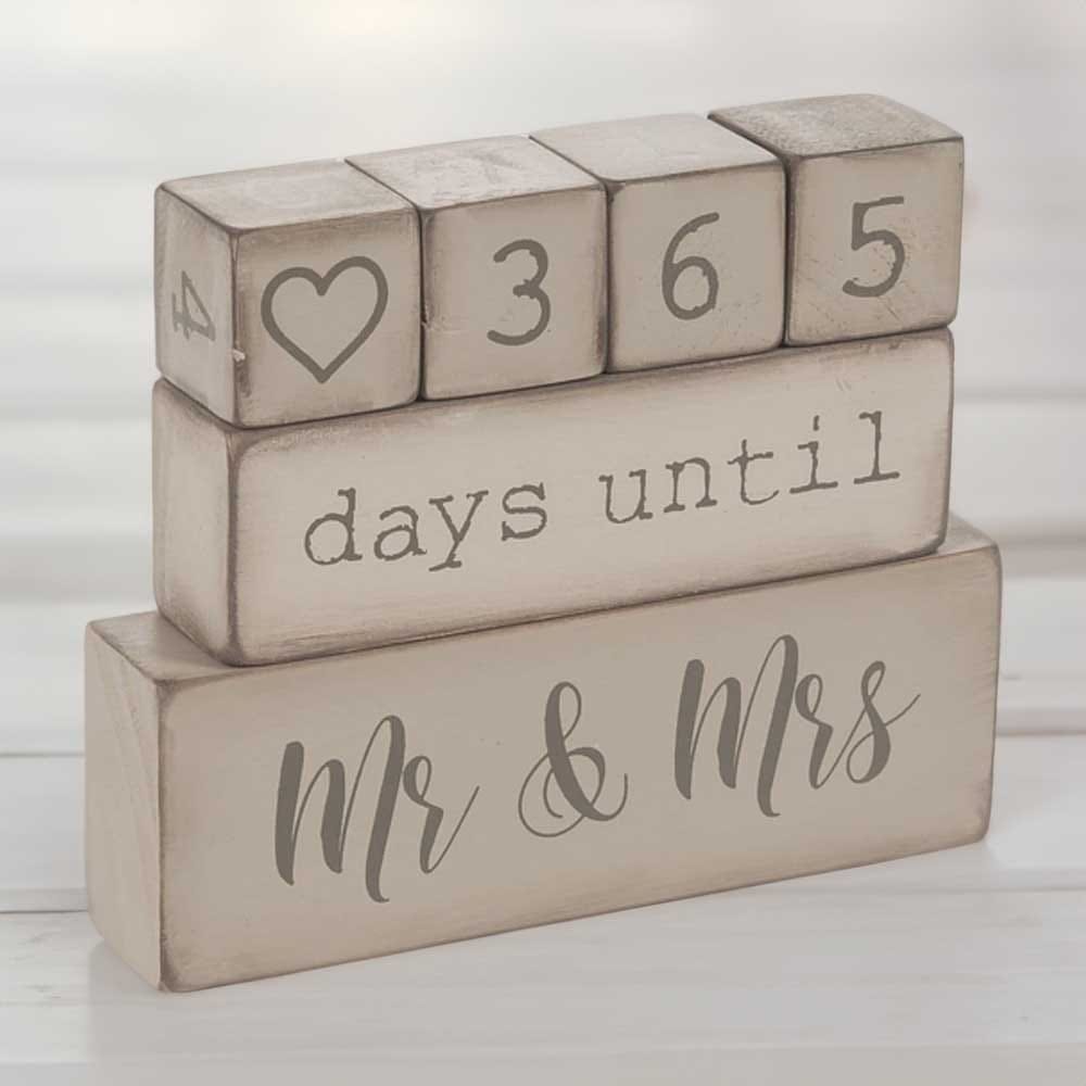Rustic wooden countdown blocks for engaged couples — charming way to track days until the wedding with stackable pieces and farmhouse style