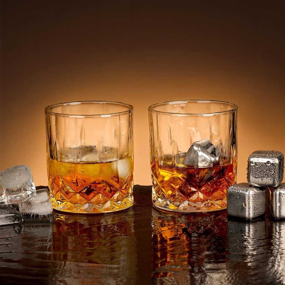 Whiskey gift set with crystal glasses, golden whiskey stones, and tongs — elegant anniversary gift for whiskey-loving husbands
