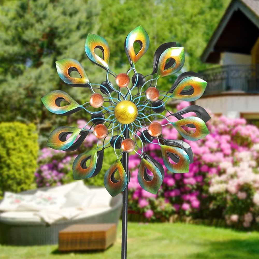 Colorful kinetic wind spinner garden sculpture — peacock-inspired outdoor art made from durable metal, perfect housewarming gift for patios and lawns