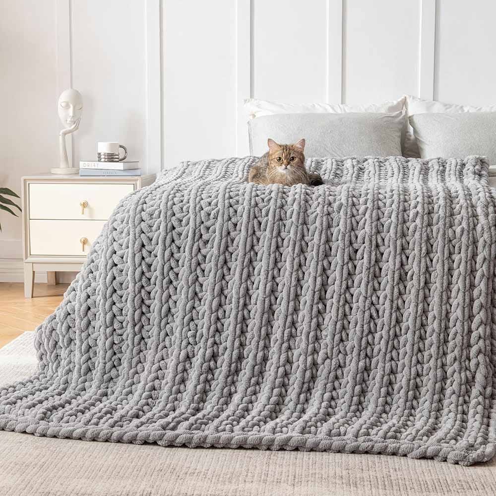 Chunky hand-knit weighted blanket in soft yarn — cozy and calming birthday gift for moms who love to relax