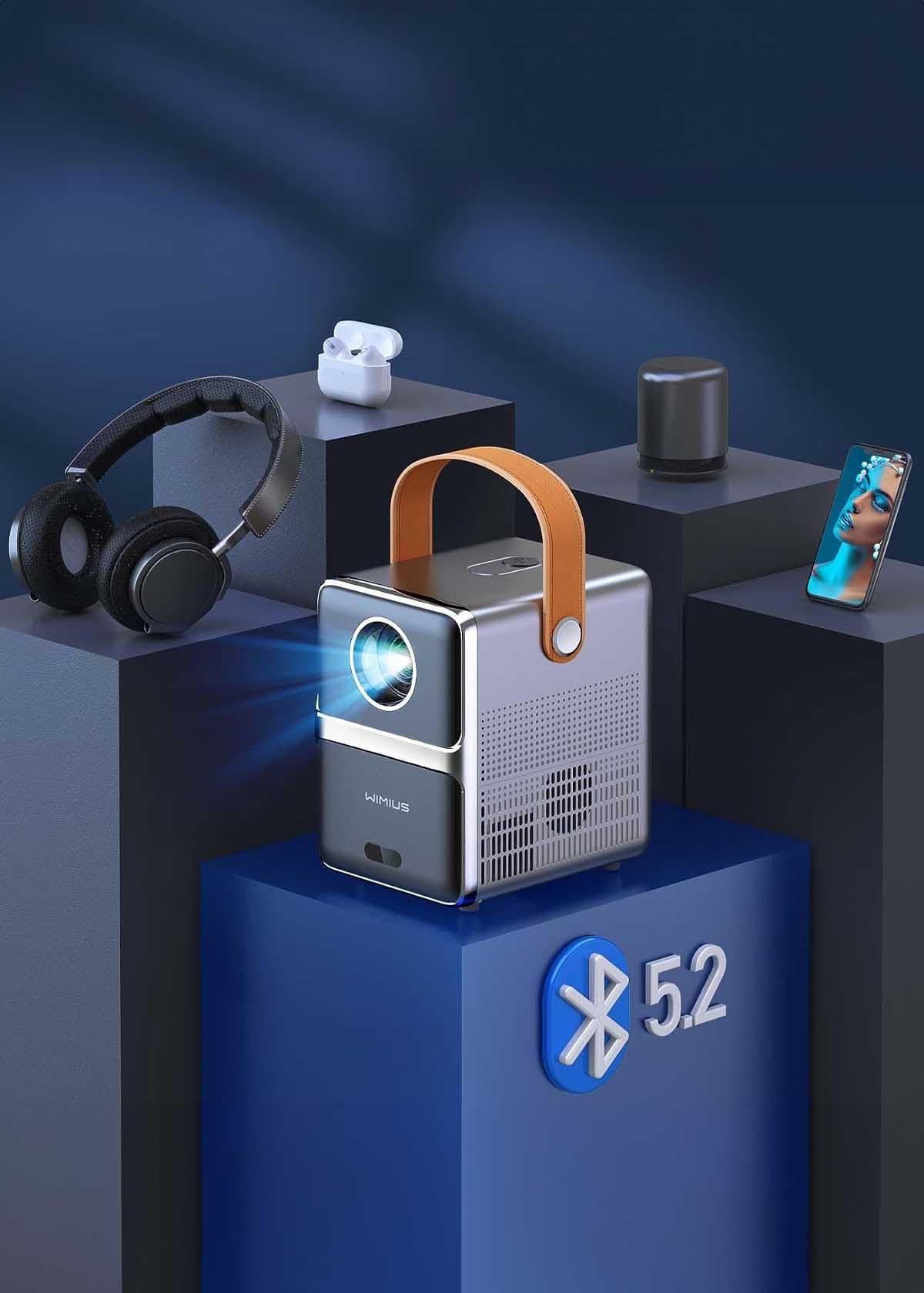 Luxury studio display of teen-friendly gadgets - including a movie projector, headphones, smartphone, and Bluetooth speaker