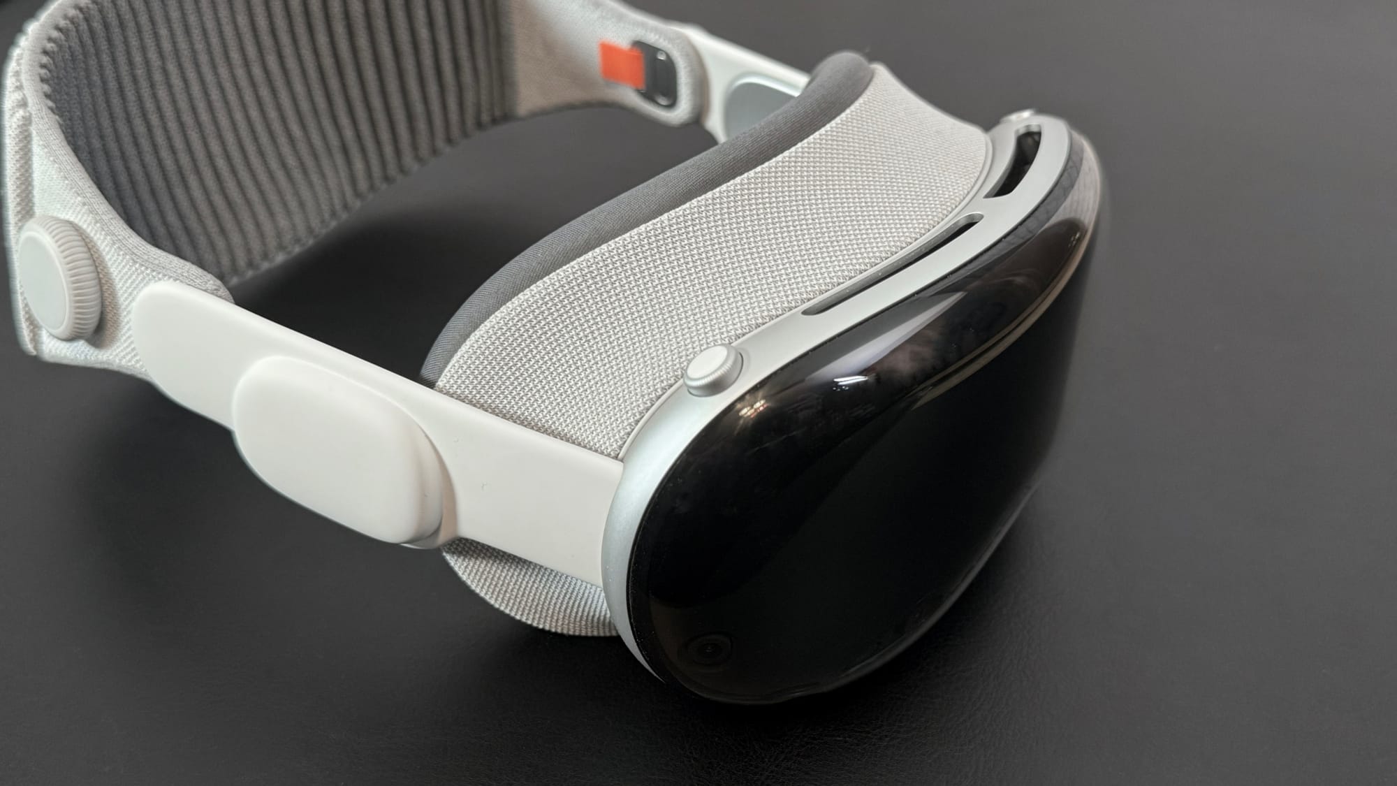 Apple Vision Pro on a dark tabletop