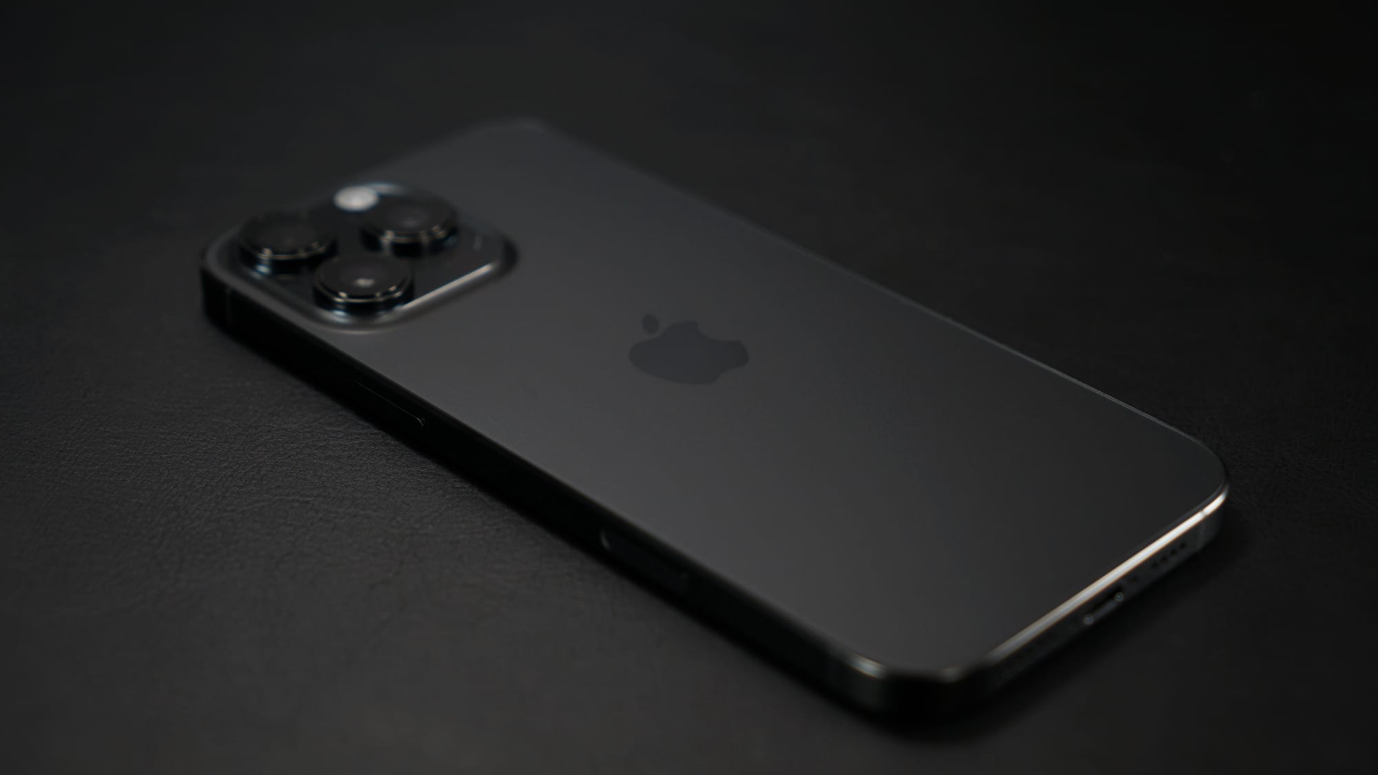 iPhone 16 Pro Max on a black surface