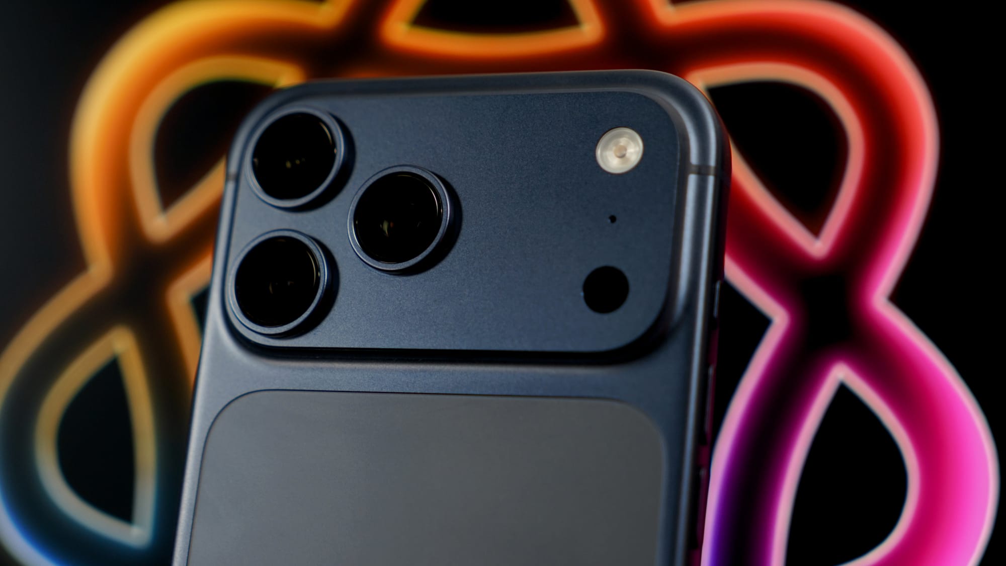 iPhone 17 Pro Max against the Apple Intelligence logo as the background