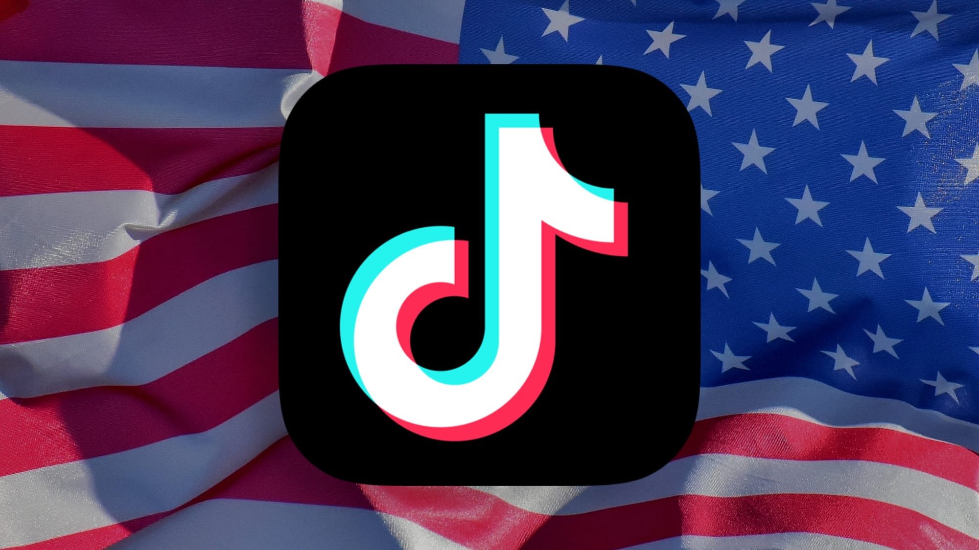 The TikTok app icon shown in front of an American Flag blowing in the wind right to left