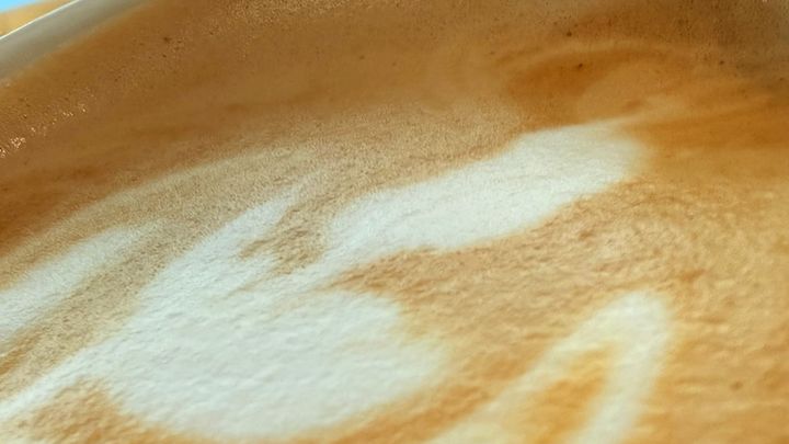 A macro photo of foam on coffee