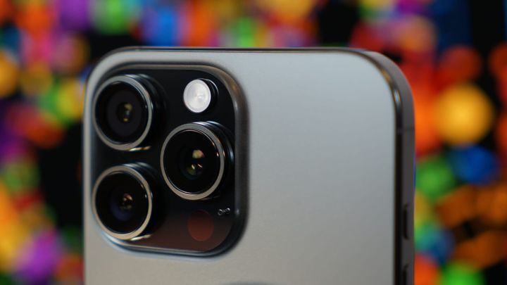 iPhone 16 Pro Max camera bump taken close with a rainbow colored backdrop