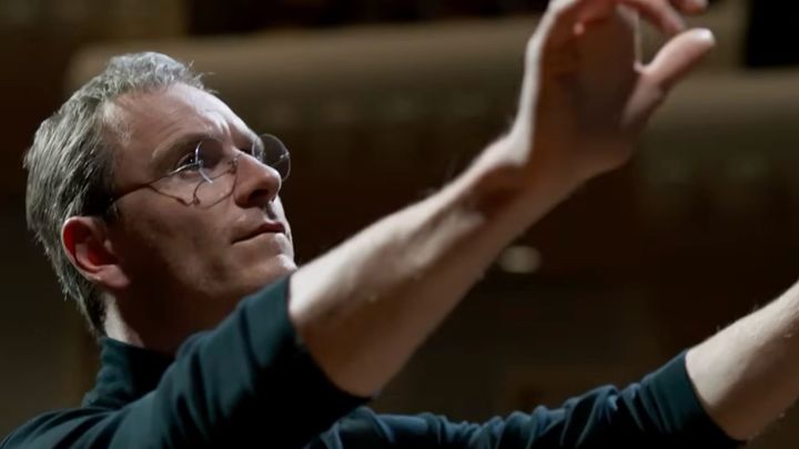 Michael Fassbender dressed in a black turtleneck and round glasses to act as Steve Jobs in a film
