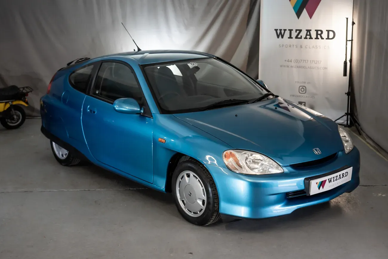Honda Insight azul, vista lateral