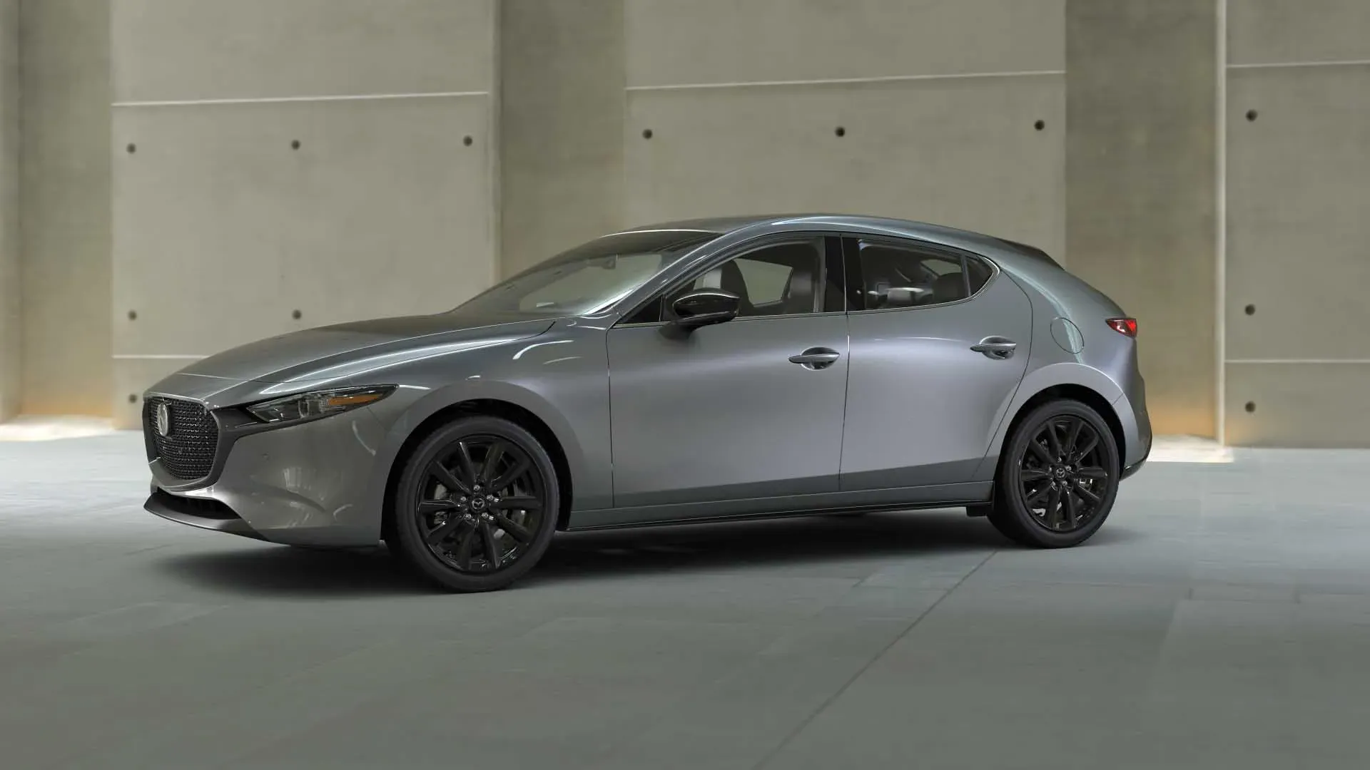 Vista 360 del mazda 3 hatchback gris titanio