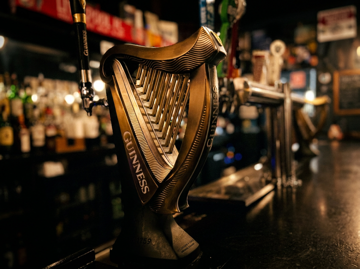 A Guinness harp tap at a quiet bar that’s cleaned at the end of the night. No people in sight. 