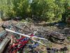 Des monticules de vélos et de pièces de vélos dans un secteur boisé du Champ des Possibles.