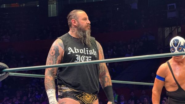 Brody King wearing an "Abolish ICE" shirt