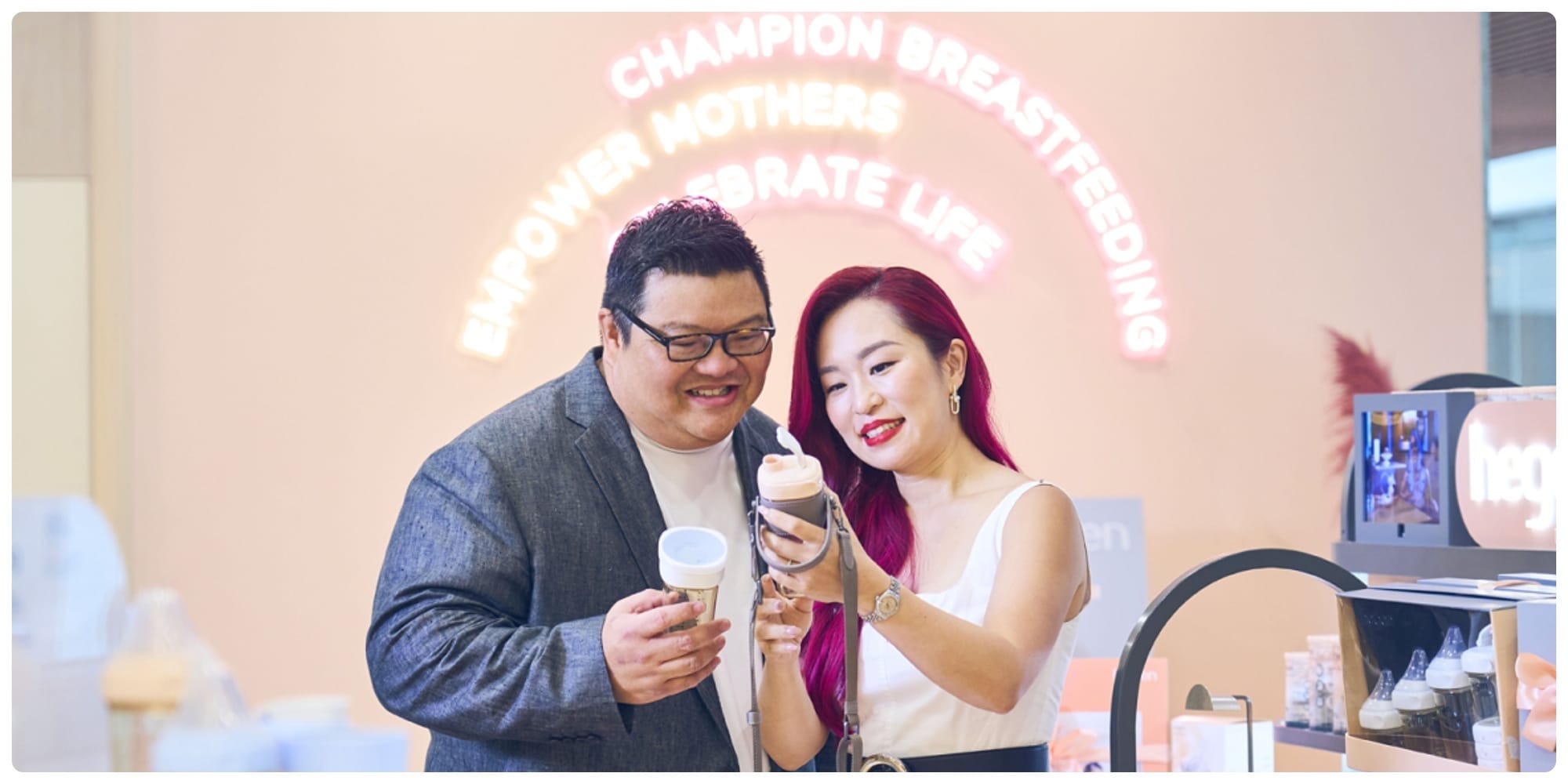 Customer interacting with Hegen baby care products in Singapore, featured among five standout local brands.