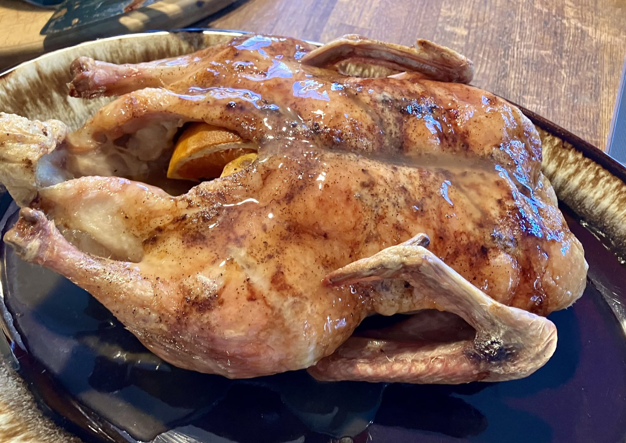 A roasted duck on a plate