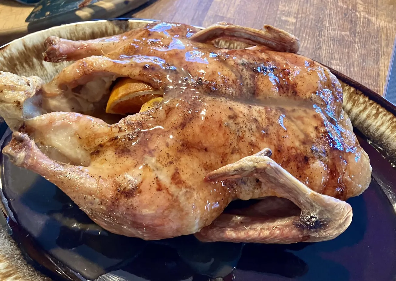 A roasted duck on a plate