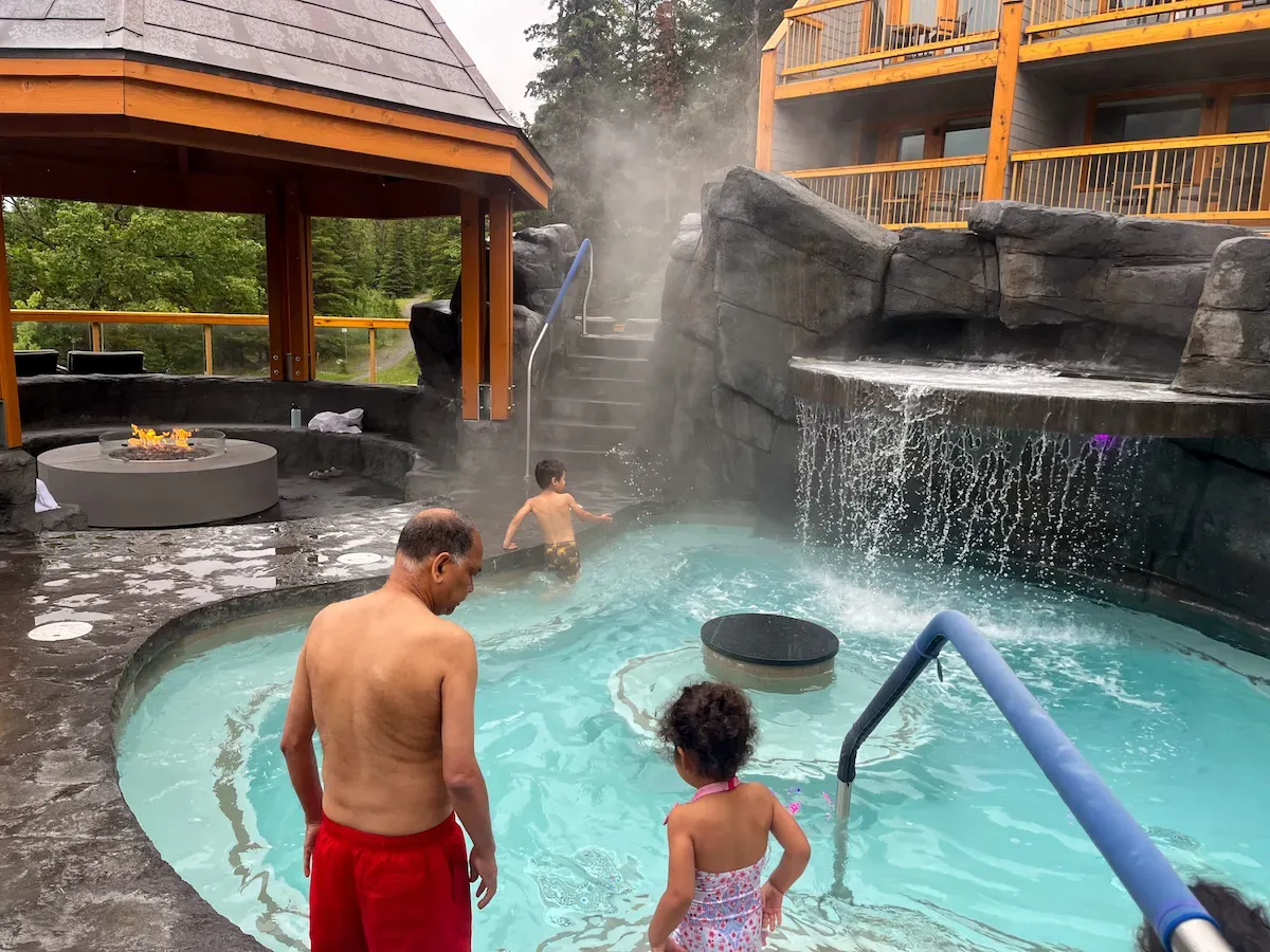 Family in thermal pools at Hotel Canoe Banff after a day exploring the Canadian Rockies