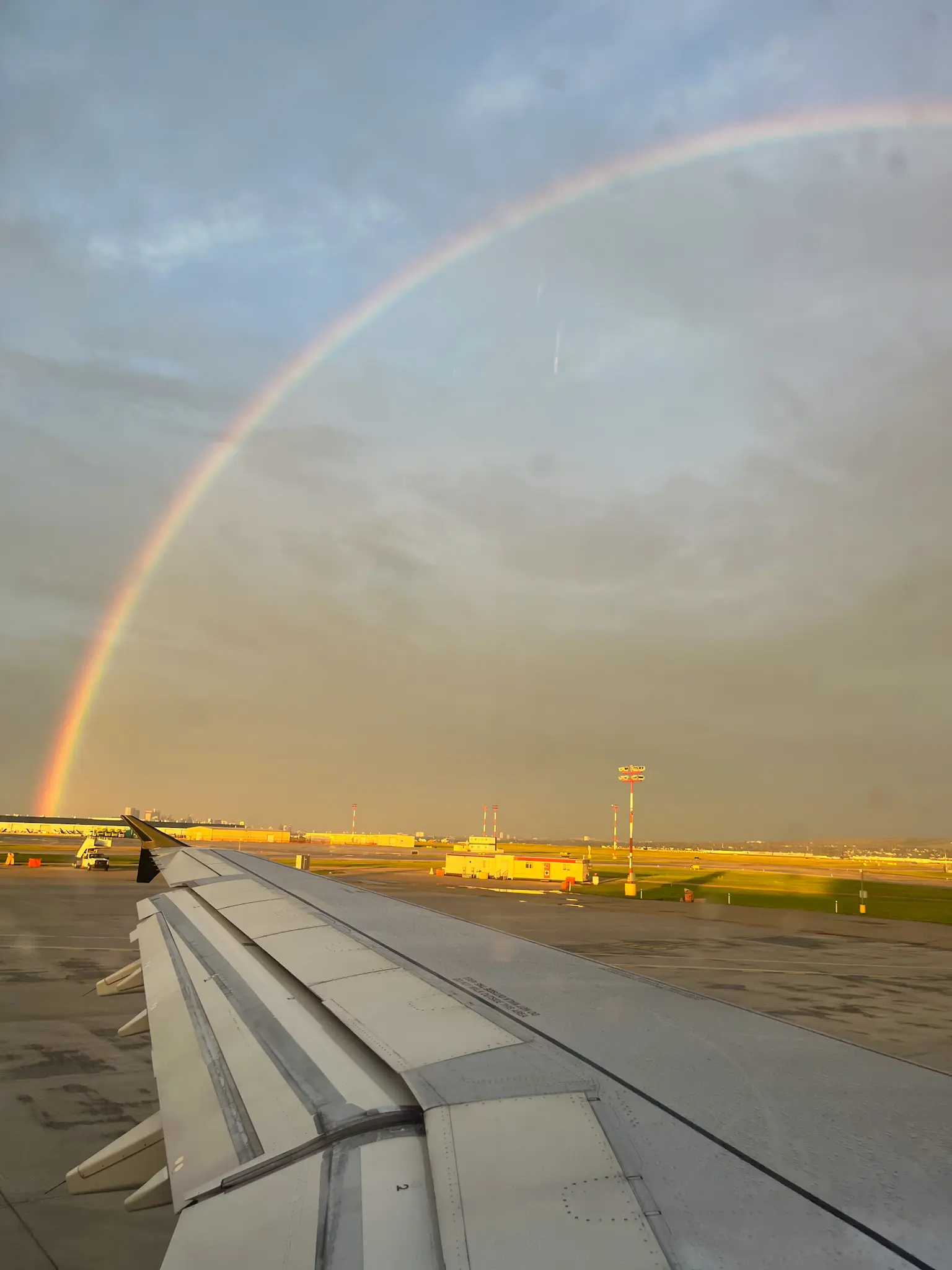Rainbow over Calgary Airport final night Delta Hotel end of Canadian Rockies family trip