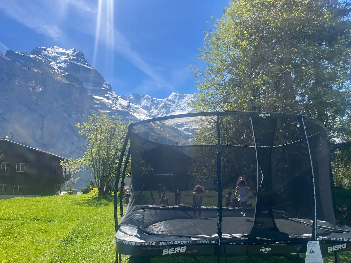 Wide mountain landscape with trampoline, Männlichen Jungfrau region Switzerland