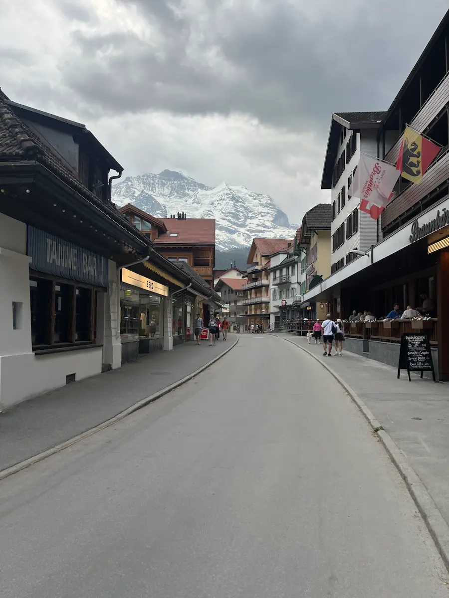 Car-free Wengen village street with mountain views, Switzerland Jungfrau Region family travel with toddlers and grandparents