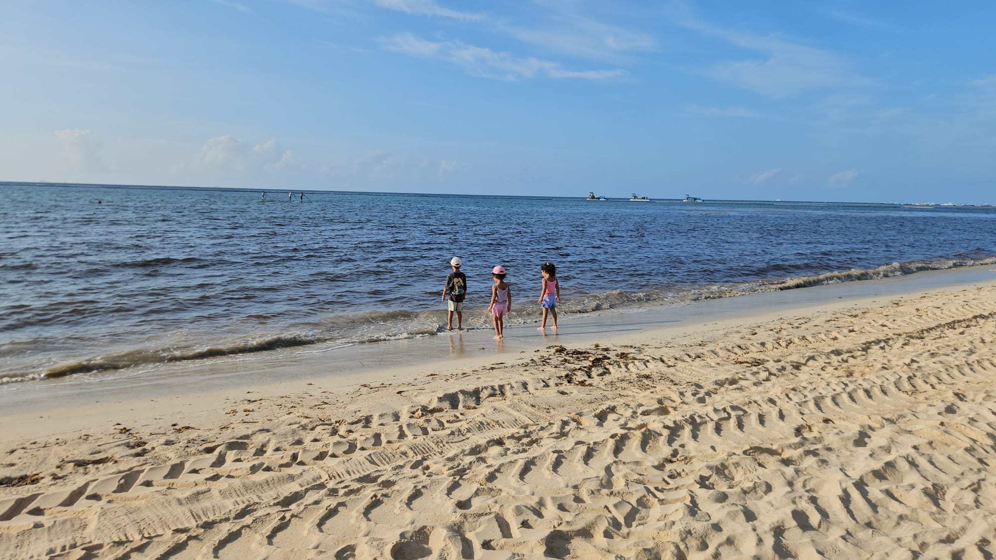 Empty wide view of the beach at Paradisus Playa del Carmen, sand and sea visible.