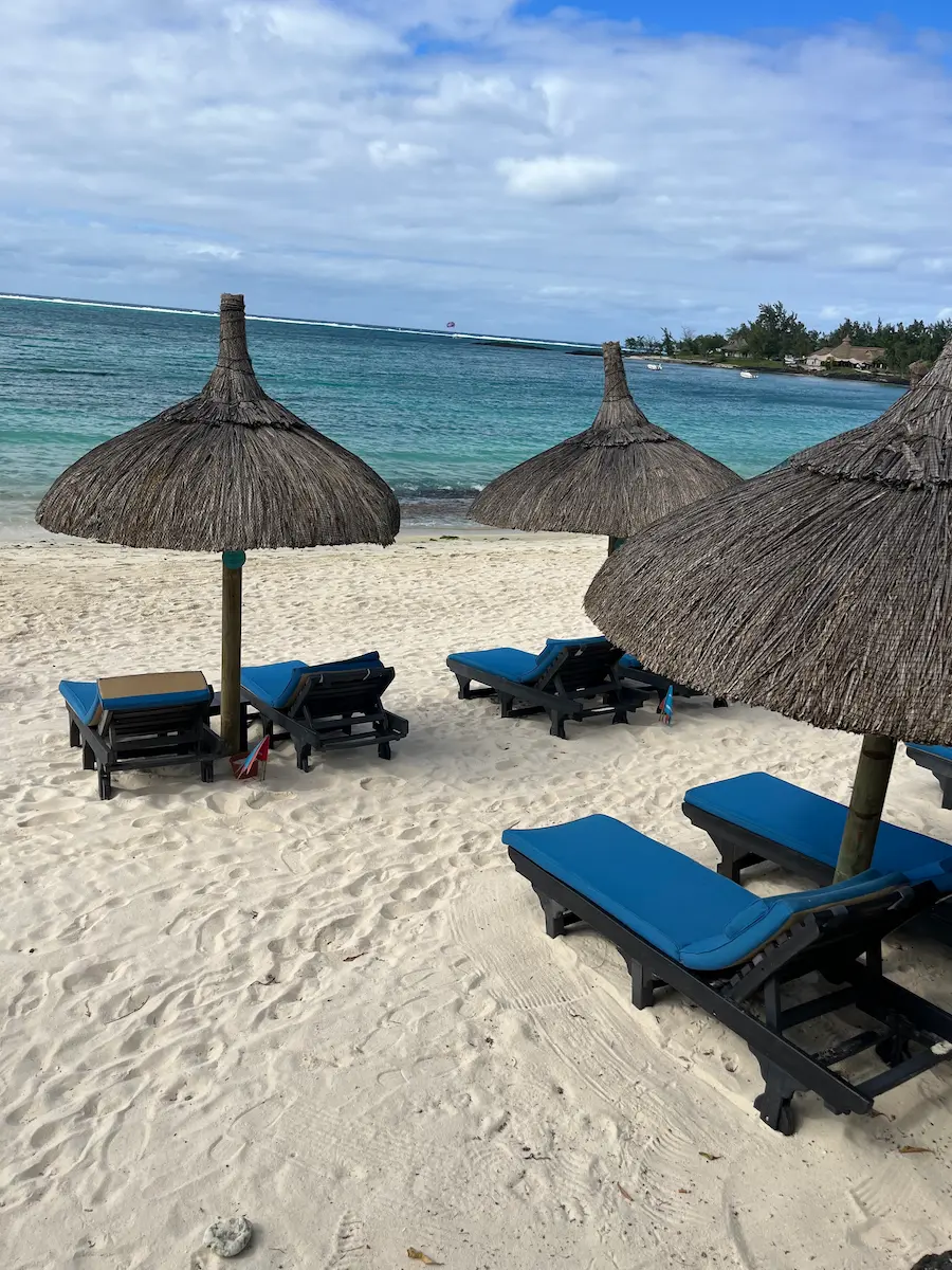 Empty sun loungers on a quiet stretch of beach in the Belle Mare area of Mauritius, the calm after four days of wedding celebrations.