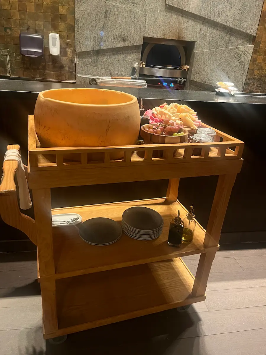 Cheese wheel and pizza oven at cappella paradisus