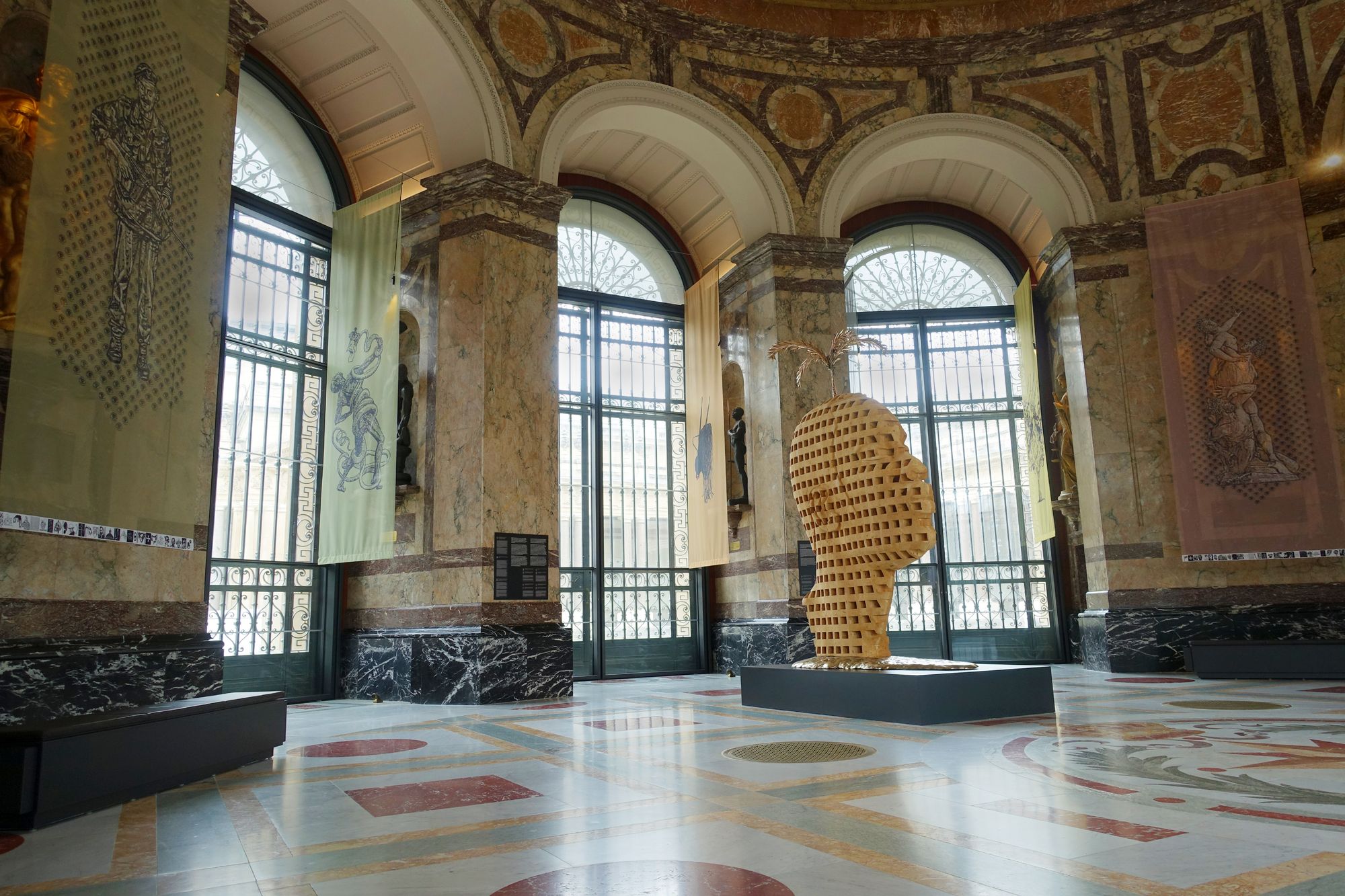 The artworks of Aimé Mpane and Jean-Pierre Müller in the museum's large rotunda. © Tim Debroyer