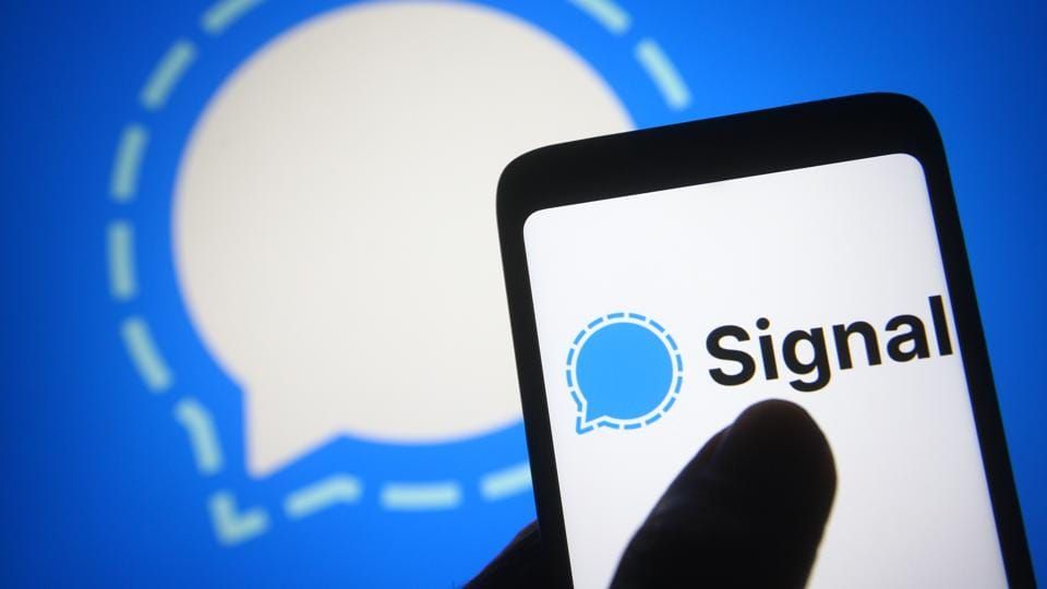 In this photo illustration a Signal logo is seen on a...