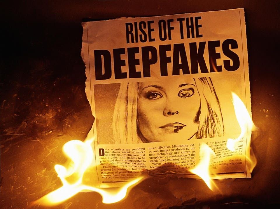 Burning newspaper clipping about deepfakes