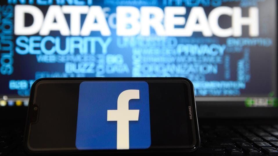 Facebook logo is seen on a Huawei smart phone with the word